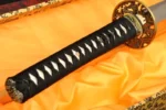 Japanese katana handle wrapped in black and white silk over real ray skin