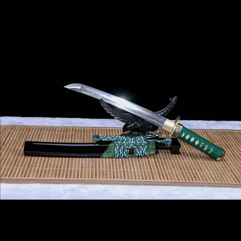 Copper fittings set on hand-forged Damascus tanto sword